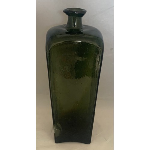 53 - An 18th century free blown green glass gin bottle 26 cm high.