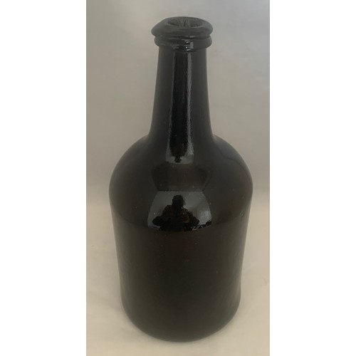 54 - 18th century black glass cylinder bottle, 24 cm high.