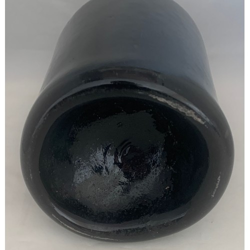 54 - 18th century black glass cylinder bottle, 24 cm high.