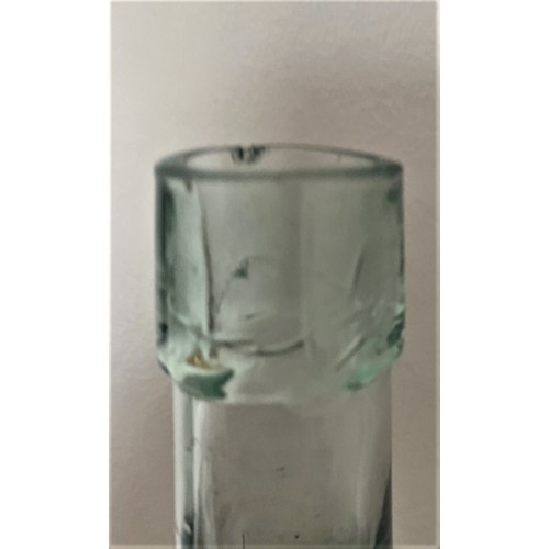 103 - Guernsey clear glass bottle with Coat of Arms, 'ST Sarnian Tonic Sole Makers Guernsey Aerated Water ... 