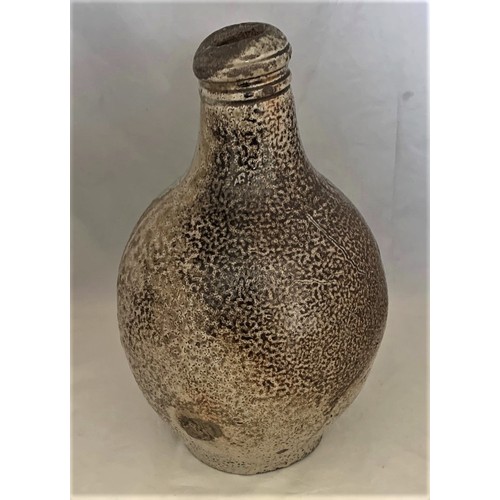 8 - A German late 17th century/early 18th century salt glazed stoneware wine flagon with part mottled gl... 