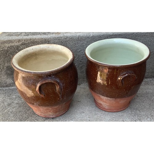 11 - A pair of Terracotta Dairy Bowls, with interior white glaze and exterior treacle glaze, 19 cm high, ... 