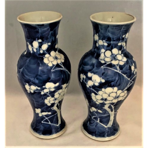 61 - Pair of Chinese blue and white Prunus decorated vases, 19th century, of baluster form, the bases wit... 