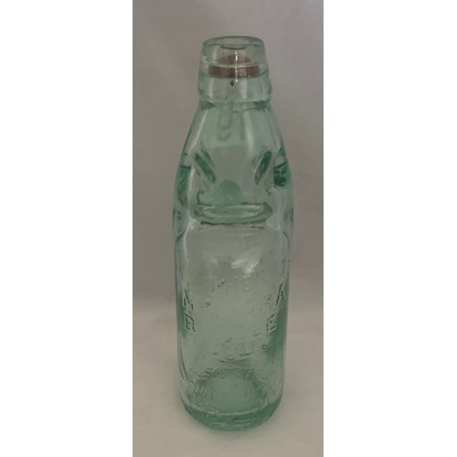 19 - Guernsey aqua glass Codd bottle, J.Renouf Niagara Works, 22 cm high.