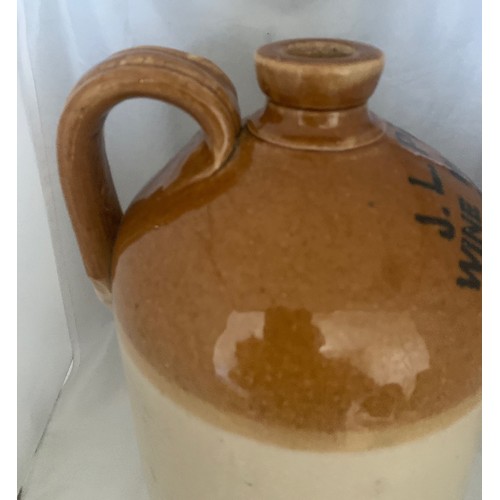 20 - A very rare stoneware two tone  flagon, J.L.Pells Wine Merchant Guernsey circa 1890, 32 cm high.