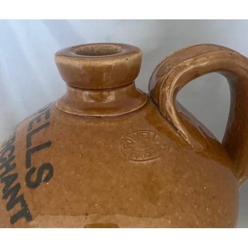 20 - A very rare stoneware two tone  flagon, J.L.Pells Wine Merchant Guernsey circa 1890, 32 cm high.