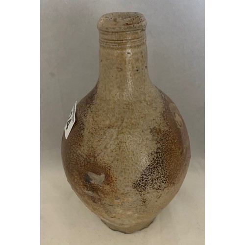 24 - 17th century salt glazed flagon with ring handle, some chips to base, a/f 24 cm high.