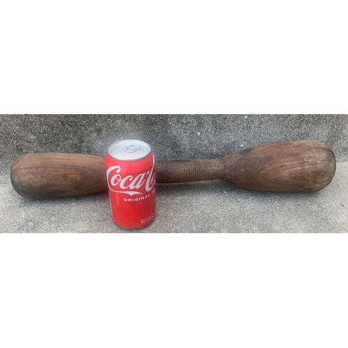 38 - Treen/Kitchenalia - A heavy turned wooden grain grinder, of dumbbell form, 50 cm long, a/f. Found in... 