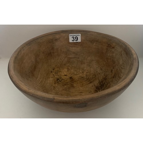 39 - A vintage sycamore dairy bowl, late 19th century, the exterior with incised banding, recently restor... 