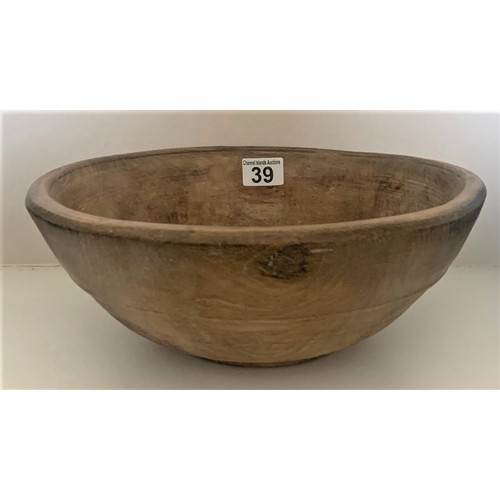 39 - A vintage sycamore dairy bowl, late 19th century, the exterior with incised banding, recently restor... 