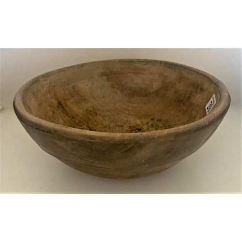 39 - A vintage sycamore dairy bowl, late 19th century, the exterior with incised banding, recently restor... 