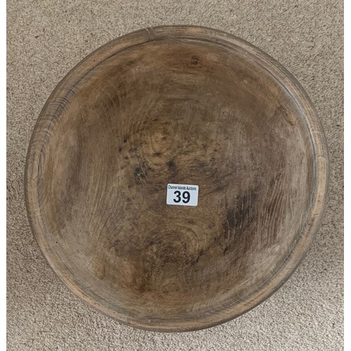 39 - A vintage sycamore dairy bowl, late 19th century, the exterior with incised banding, recently restor... 