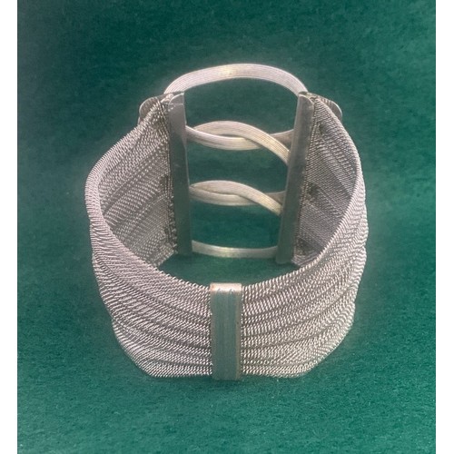 82 - White metal Danish style wrist bangle, apparently unmarked.