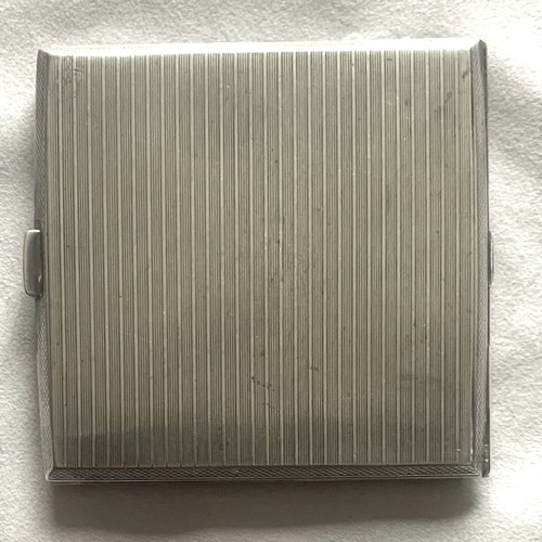 90 - A silver cigarette case, Birmingham 1932, by S.W.Goode & Co. with vacant cartouche and engine turned... 