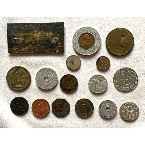 188 - A collection of tokens, apothecary weight, checks etc. (16).