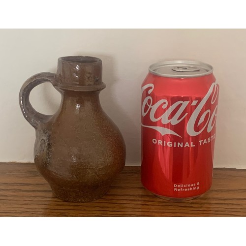 9 - English late 18th century glazed bottle with ring handle, 13cm high, a/f.