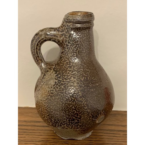 14 - An attractive  mid. 18th century Rhineland glazed flagon, of diminutive size with ring handle, 17cm ... 