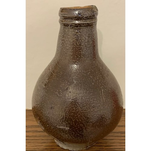 14 - An attractive  mid. 18th century Rhineland glazed flagon, of diminutive size with ring handle, 17cm ... 