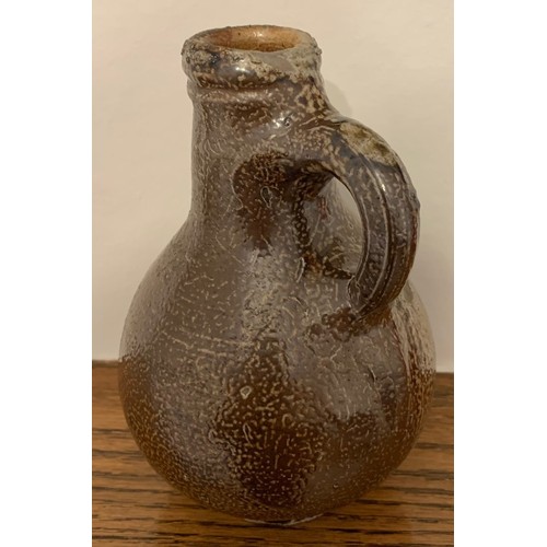 14 - An attractive  mid. 18th century Rhineland glazed flagon, of diminutive size with ring handle, 17cm ... 