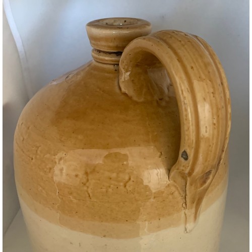 21 - Stoneware two tone flagon, impressed 'J.B. Renouf Wine Merchant Guernsey' 29cm high.