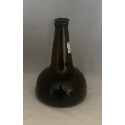 35 - Black glass mallet-shaped  or Transitional wine bottle, 18th century, with applied neck ring and dee... 