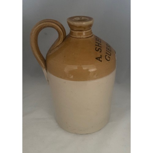 40 - Stoneware two tone flagon, with black transfer 'A.Sheppard Guernsey' quarter gallon size 21cm high.