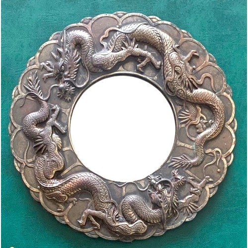 83 - Chinese white metal cased circular wall hanging Ladies makeup mirror, the outer surround with two dr... 