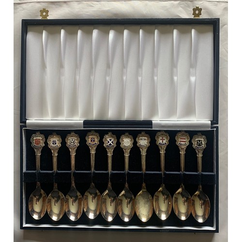 103 - Cased set of ten Guernsey Parish silver plated and enamel spoons, retailed by Bruce Russell (10).