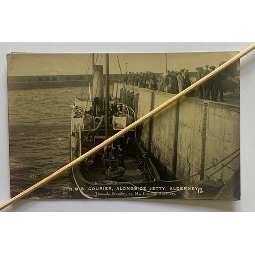 158 - Real photographic postcard by Bramley, R.M.S. Courier Alongside Jetty Alderney.