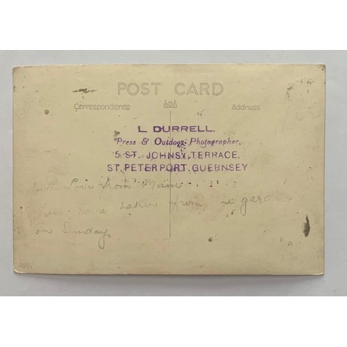 110 - Real photographic postcard by L.Durrell, a parade on Guernsey seafront, showing crowds of people wat... 