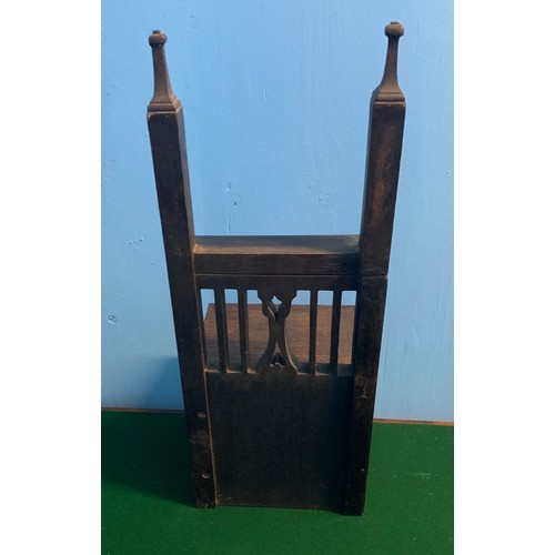 4 - A child's miniature Gothic style oak chair, 56cm wide, 21cm high.