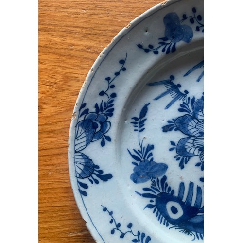 50 - A Chinese export blue and white plate, early 19th century, with central flower and decorated floral ... 