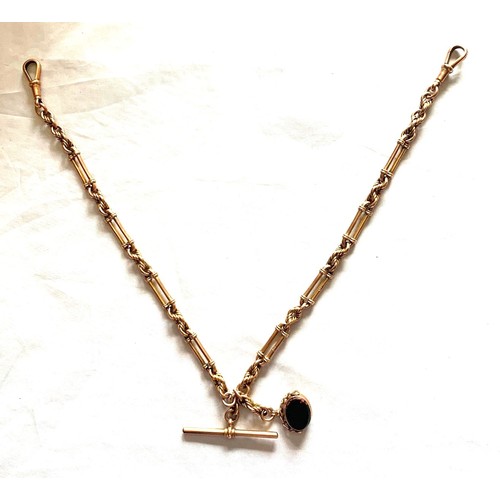 60 - 9 carat gold watch chain, with gold T Bar and rotating stone fob, total weight 34.88 grams.