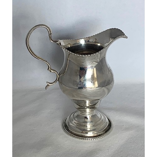 28 - William IV silver cream jug, London 1836, silversmith's mark partly rubbed, of baluster form with be... 