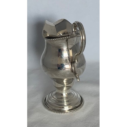 28 - William IV silver cream jug, London 1836, silversmith's mark partly rubbed, of baluster form with be... 