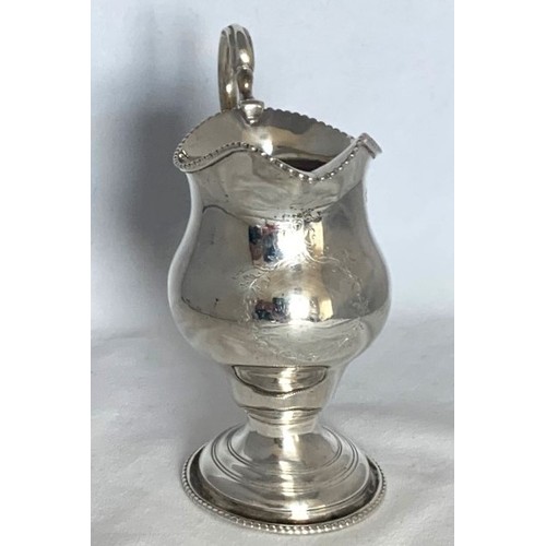 28 - William IV silver cream jug, London 1836, silversmith's mark partly rubbed, of baluster form with be... 