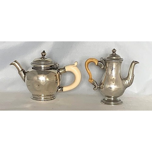 9 - A miniature white metal teapot with bone handle, together with a miniature white metal coffee pot wi... 