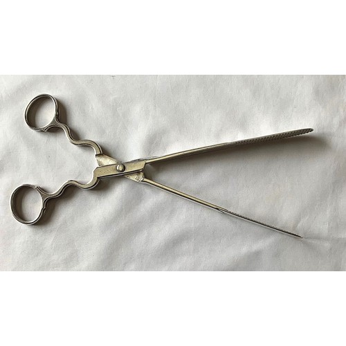 14 - A pair of silver scissor action asparagus tongs by Thomas Henning London 1763, with loop handles,  w... 