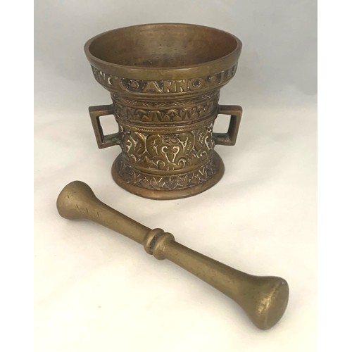 49 - A 19th century bronze Mortar and Pestle, with Latin legend to top, 9cm diameter.