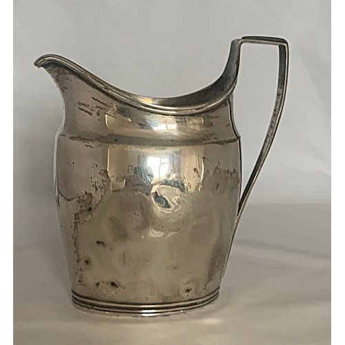 42 - A silver cream jug of helmet form, with reeded handle, hallmarks indistinct, weight 95 grams, 10.5cm... 