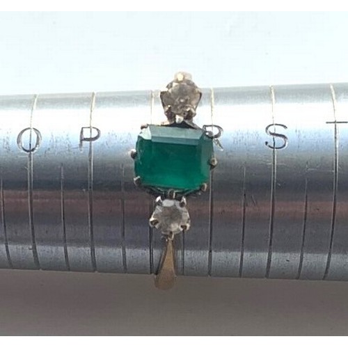 76 - 9 carat gold ring set with central cushion cut emerald flanked by two diamonds, total weight 2.25 gr... 