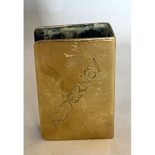 81 - A brass matchbox holder, engraved with a map of Alderney in the Channel islands, 6 x 4cm.