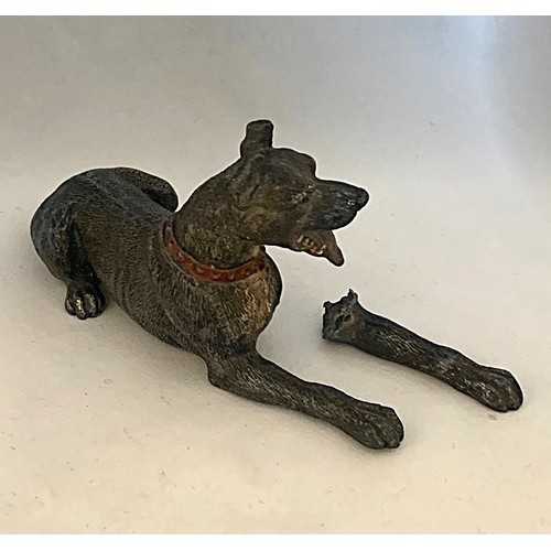 82 - A cold painted metal dog ornament, in as found condition, 17cm long.