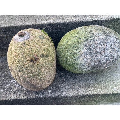 101 - Two Guernsey Granite corn weights.