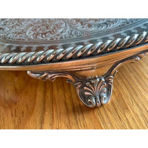 7 - Circular silver plated tray early 20th century, the centre engraved with a bird standing on a castel... 