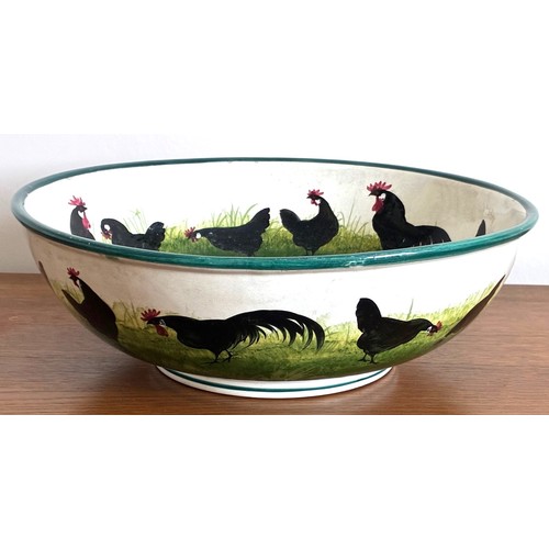 28 - Wemyss Ware pottery bowl of large proportions, decorated with twenty-three black painted Cockerels a... 