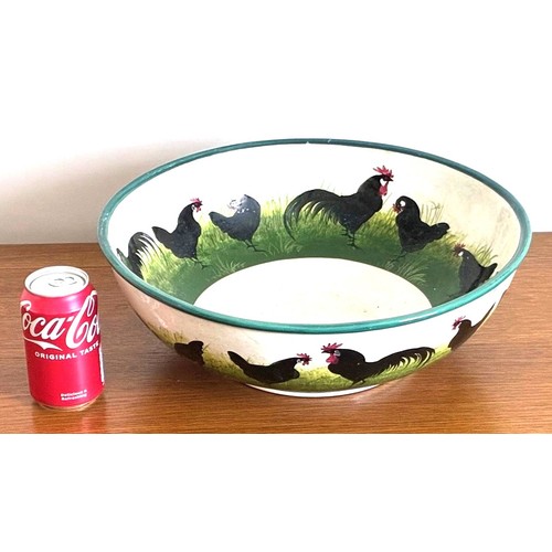 28 - Wemyss Ware pottery bowl of large proportions, decorated with twenty-three black painted Cockerels a... 