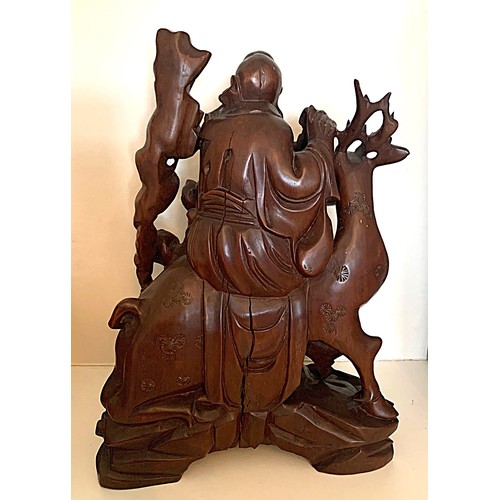 25 - Chinese carved hardwood group, Shou Lao riding a Stag whilst holding a carved staff, with attendant ... 