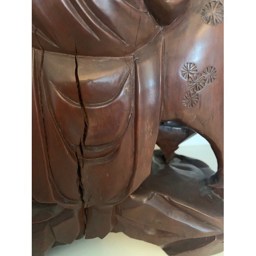 25 - Chinese carved hardwood group, Shou Lao riding a Stag whilst holding a carved staff, with attendant ... 