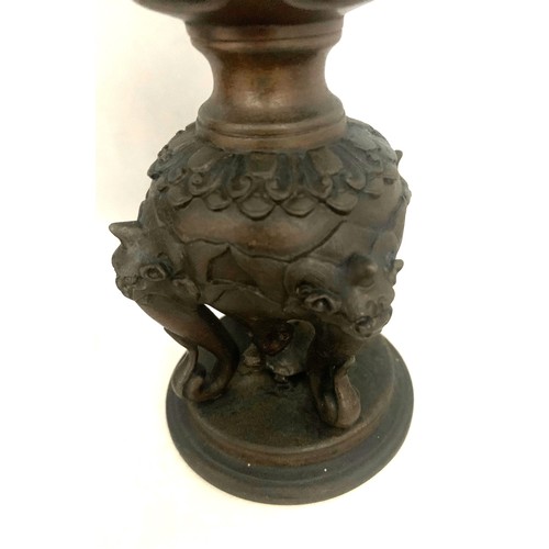 53 - Pair of Chinese bronze candle sticks, late 19th century, with dragon mask handles, elephant trunks, ... 